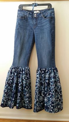 "Redesigned Bell Bottom Jeans, size 10 I redesigned a pair of Levis Jeans by removing the bottom portion of the legs and adding a 19\" length ruffle of Blue Floral Print Gauze Fabric. This pair of jeans is a light weight, dark stretch denim. All of the reconstructed denim items I make are one-of-a-kind! Jeans - 99% Cotton, 1% Elatane Gauze - 100% Cotton Size on tag: Levis, Size 10 Waist 32 in Inseam 34 in Rise 10 in Length/Outseam 43 in  Width of the bottom ruffle is 29 in across while laying on flat surface Measurement across waistband while flat is 16 inches This garment has been prewashed. Wash on delicate cycle. Please contact me if you do not see the size you need in the style you want. I am happy to discuss any custom order options.  Thank you for your interest in my work and for bro Reconstructed Denim, Birthday Outfit For Women, Blue Jeans Crafts, Boho Jeans, Artsy Outfit, Bottom Jeans, Crazy 8, Old Jeans, Gauze Fabric