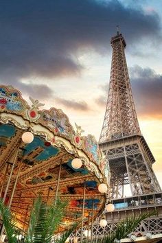 the eiffel tower in paris is lit up with lights on it's sides