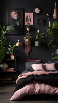 a bedroom with black walls, pink bedding and potted plants on the wall