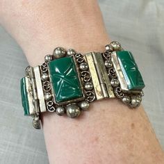 This Fantastic Bracelet Is Most Likely From The 1970s And Was Made In Mexico. Stamped On The Back Of The Clasp, Hecho En Mexico (With Part Of It Not Fully Stamped). Probably Taxco, Also Stamped "Ham" Inside A Circle. Some Tarnishing And Wear Consistent With Age, Still In It's Original Box. Gorgeous Green Onyx Carved Into Masks, Each One Set In A Fancy Filigree And Ball Sterling Frame. Two Matching Rings Are Also For Sale In My Closet! Measures 7" Long, And 1-1/4" Wide. From A High End Estate. Mid-century Adjustable Silver Jewelry, Mid-century Silver Bracelet, Silver Bracelet Gift, Vintage Green Sterling Silver Bracelets, Vintage Mexico, Chunky Bracelets, Hinged Bracelet, Upcycled Jewelry, Matching Rings