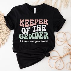 a t - shirt that says keeper of the gender i know and you don't