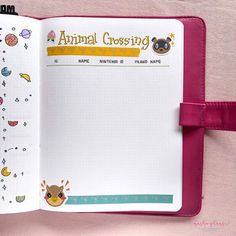 an animal crossing notebook with stickers on the pages and a pink ribbon around it