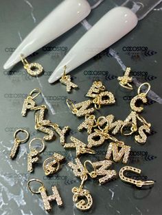 26pcs A-Z diamonds Zircon Nail Letters dangling Nail Charms 3D 💎 26pcs/pack (entire Alphabet) 💎 Material: metal alloy 💎 Colors : Gold 💎 It comes with pierces as shown 💖Please check out another dangling letters here: https://www.etsy.com/CocoStop/listing/1208461123/26pcs-a-z-rhinestone-nail-letters? 💖High quality and Easy Used: Garment, Nail Art, Shoes, Cell Phone, Box, Pen, greeting cards....etc 💖Many styles of rhinestone charms nail art accessories are available in shop .Please check out Letter Charms On Nails, Nail Dangle Charms, Nails With Dangle Charms, Cosmetology Kit, Nails Matching, Nail Polish Gift Set, Press On Toenails, Nail Polish Holder, Nail Polish Gift