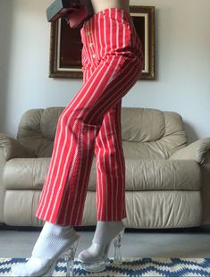 Levi's for Gals Candy striped 1960s low-rise pants in twill cotton with a button fly. Two front pockets. No visible flaws, incredible condition! 26" waist 36" hip 10" rise 26.5" inseam Red Cotton Bottoms With Buttons, Striped Bottoms With Buttons For Summer, Striped Summer Bottoms With Buttons, High Waist Pinstripe Cotton Bottoms, Striped Cotton Bottoms With Buttons, Vintage Striped Straight Leg Bottoms, Retro Cotton Bottoms With Buttons, Retro Style Wide Leg Pants With Button Closure, Retro Wide Leg Pants With Button Closure