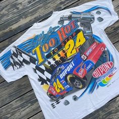 a white t - shirt with the number twenty four on it and a racing car