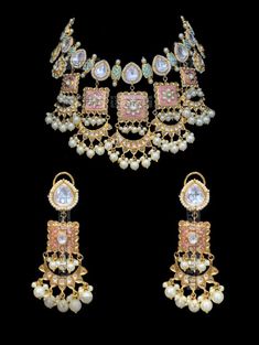 "Palavi Enameled Meenakari Bridal Set Regardless what the occasion be this set is versatile for all your outfits. Wear the beautiful enameled Meenakari set during your mehndi & sangeet event. The colours of this set work with all colours. Exquisite kundan craftmanship along with those pastel droplets makes this set a complete showstopper. A classic set of jadau kundan and enameled motifs strung in harmony with faux pearl beads. The necklace comes along with beautiful pair of earrings. Approx Luxury Kundan Meenakari Danglers, Luxury Meenakari Party Sets, Kundan Jewelry With Motifs For Eid, Multicolor Meenakari Temple Jewelry Sets, Bollywood Kundan Jewelry With Motifs, Bollywood Style Kundan Jewelry With Motifs, Multicolor Kundan Meenakari Jewelry, Multicolor Kundan Jewelry With Meenakari, Multicolor Meenakari Kundan Jewelry