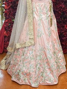 Go all out in this whimsical lehenga, studded with precious mirror, pearl, stone, embroidery work, which is sure to bring out the innate grace and grandeur in you! Color - Light Pink Fabric & Work Style - - Silk blouse: mirror, pearl, stone, embroidery work. - Soft net lehenga: mirror, pearl, stone, embroidery work. - Soft net dupatta: embroidery work. Details - - Assured quality - Wash care instruction: Dry clean only. - Slight variation in color is possible due to digital photography. Bridal Lehenga Indian, Bridal Jewelry Indian, Dupatta Embroidery, Lehenga Indian, Stone Embroidery, Indian Bridal Jewelry, Fabric Work, Indian Bridal Lehenga, Net Lehenga