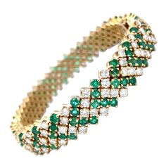 18 Karat yellow gold bracelet featuring diamond and green emeralds in a chevron motif design. Green Emerald - 6.50 Carats Diamonds - 6.90 Carats Retro Bracelet, Motif Design, Yellow Gold Bracelet, Emerald Diamond, Emerald Green, Arm Band, Anklets, Emerald, Gold Bracelet