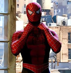 a spider - man is standing in front of a window