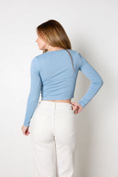 This sculpt knit top has your outfit goals covered--it's light blue hue brings the sky's vibrancy to your wardrobe and its bodycon fit shows off your silhouette with style and grace. Long sleeves and a scoop neckline complete the look with a hint of elegance. It's the perfect top to wear as the seasons change! Materials: 90% Polyamide and 10% Spandex All sale items are considered final sale. Blue Top Outfit, Light Blue Top, Seasons Change, Adhesive Bra, Style And Grace, Outfit Goals, Blue Top, Changing Seasons, Blue Hues