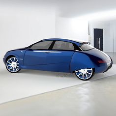 a blue car is parked in an empty room with white walls and flooring on the side