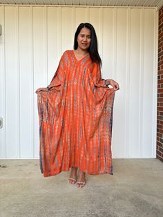 This kaftan, made from rayon fabric and hand dyed, is versatile for many occasions. It complements all body types with its long, hangs loose design and slits up both sides. It can be worn in many different stylish ways to make you look your best! DETAIL • All measurements are flat• Bust/ Waist/ Hips 34 in. (Circumference 68 in.)• Arms 11 in. (Circumference 22 in.)• Length 50 in. The model wear • V-Neck • Side slits• No pocket• Slipover style• All above measurement are flatFABRIC• 100% Rayon FIT• Flowy Natural Dye Maxi Dress, Flowy Maxi Dress With Natural Dye, Rayon V-neck Kaftan For Beach Cover-up, Long Bohemian Rayon Kaftan, V-neck Rayon Kaftan For Beach Cover-up, Flowy Tie Dye Kaftan Tunic, Flowy Tie-dye Tunic Kaftan, Tie Dye Flowy Tunic Kaftan, Flowy Hand Dyed Maxi Dress For Vacation