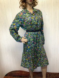 Dress Apron Nylon Vintage Women Flower Blouse Dress Blue, Green, Pink Apron Long Sleeves Floral Dress Brand: not specified Size listed: not specified, suitable from 38 to 44 (M/L) Era: 70s Material: nylon Color: blue, green, pink, yellow Patterns: flowers Sleeves: long sleeves, 1 button on the wrist Length: below the knee Collar: shirt collar Closing: buttons all over the front Pockets: 2 front plated pockets Lining: no Belt: not included Suitable from 38 to 44 (M to L) (2 to 3) (UK.10 to 16) (U Vintage Long Sleeve Floral Summer Dress, Vintage Floral Long Sleeve Summer Dress, Long Sleeve Vintage Dress With Floral Print For Summer, Blue Long Sleeve Vintage Dress For Summer, Spring Blue Vintage Dress, Green Floral Print Vintage Dress, Blue Vintage Dress For Spring Daywear, Spring Collared Lined Dresses, Vintage Long Sleeve Floral Dress