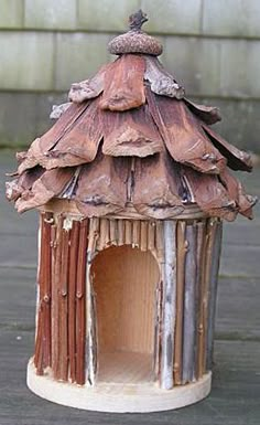 a bird house made out of wood sticks