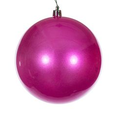 a pink ornament hanging from a string