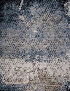 a blue and gray rug with an abstract design