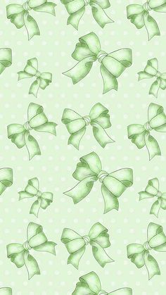 green bows on a light green background with white polka dotty dots in the bottom right corner