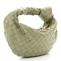 This is an authentic BOTTEGA VENETA Nappa Intrecciato Mini Jodie in Travertine. This stylish handbag is beautifully crafted of soft woven nappa leather in sage green. The bag features a woven handle and a top zipper that opens to a compact smooth leather interior. Mini Jodie, Nappa Leather, Leather Interior, Smooth Leather, Bottega Veneta, Sage Green, Zipper, Handbags, Green