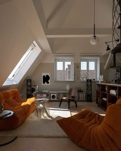 a living room filled with furniture and windows