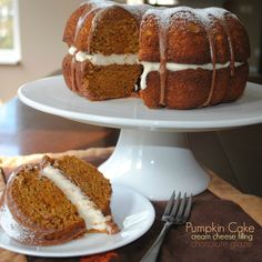 a bundt cake with white frosting on a plate