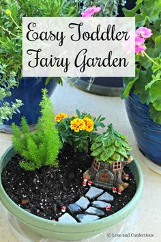 an easy toddler fairy garden in a pot with flowers and rocks on the ground