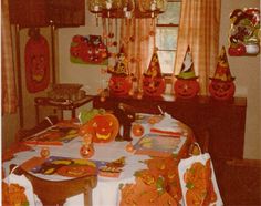 a dining room table covered in halloween decorations