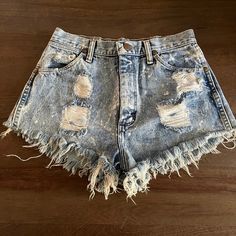 "Trashed Vintage 1980s Wrangler Cutoff Jean Shorts High Waist  Regular Fit  Button Fly  Acid Wash Denim  Size 11  Distressed Denim  Measurements (Flat Across)  Waist: 13\"  Rise: 12\"  Hips: 20\"  Legs Opening: 11\" Length: 10\" Made in USA" Vintage Distressed Cutoff Bottoms, High Waist Distressed Retro Bottoms, Retro High Waist Distressed Bottoms, Vintage Faded Summer Bottoms, Spring Vintage Distressed Bottoms, Vintage Medium Wash Bottoms With Frayed Hem, Retro Distressed Cutoff Bottoms, Faded High Rise Vintage Jean Shorts, Vintage High Waist Bottoms With Frayed Hem