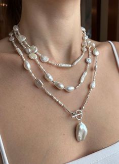 So many shapes and sizes of beautiful white freshwater pearls! Truly unique and so many wearing options. This necklace will work well with everything and will be that perfect go to necklace to wear casual or dressy!  Shown triple wrapped, can also be worn doubled or single, and is perfectly finished with a monstrous baroque focal pearl with gorgeous luster.  All beads are strung on coated stainless wire and the findings are all sterling.  Beautiful statement piece! Necklace measures 58".  Thanks for stopping by! Pearl And Amethyst Necklace, Silver Long Necklace, Pearl Jewelry Design, Long Silver Necklace, Long Beaded Necklace, Classy Jewelry, Necklace Long, Amethyst Necklace, Bead Jewellery