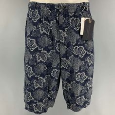 J.S. Homestead Shorts Comes In A Navy & Blue Floral Cotton Featuring Contrast Stitching, Front & Back Pockets, And A Zip Fly Closure. Made In Japan. New With Tags. Marked: 3 Measurements: Waist: 36 Inches Rise: 13 Inches Inseam: 11.5 Inches Sui Generis Reference: 114006 Category: Shorts More Details Brand: J.S. Homestead Size: L Gender: Male Color: Navy Color 2: Blue Pattern: Floral Fabric: Cotton Style: Chino Condition: 1. New Wtih Tags Made In: Japan Age Group: Adult Sui Generis Designer Consi Summer Fitted Indigo Bottoms, Blue Bermuda Cotton Pants, Blue Fitted Bermuda Shorts, Blue Relaxed Fit Short Pants, Wide Shorts, Resale Store, Consignment Stores, Color 2, Navy Color