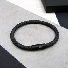 Our personalised men's woven thick leather bracelet is a perfect gift for him, now with a black matt clasp option. Our bracelets come in 4 colours black, brown, grey and navy in sizes to fit either 19cm and 21cm wrists. PLEASE NOTE - We are currently unable to include gift messages with this product. Made from 100% natural leather with the highest quality polished stainless steel clasp. Our customer service team is at hand with any queries you may have so please get in touch if you need to. Plea Date Bracelet, 3rd Anniversary Gifts, Jewelry Mens, 3rd Anniversary, Engraved Initials, Man Weave, Black Gift Boxes, Bracelet Clasps, Braided Bracelets