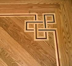 a wooden floor with an intricate design on the top and bottom part, inlayed to wood