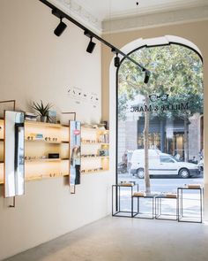 the inside of a store with an arched window