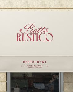 a restaurant sign above the entrance to a building