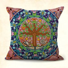 a decorative pillow with an image of a tree on it