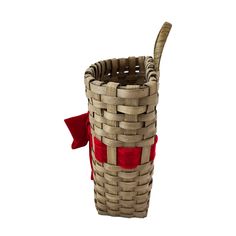 a woven basket with a red ribbon tied around the top and bottom, on a white background