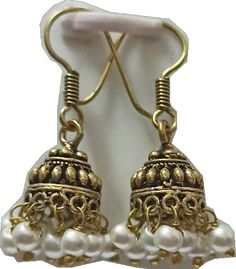 Temple Style Pearl Earrings With Latkans For Festivals, Temple Jewelry Pearl Earrings With Latkans For Festivals, Traditional White Jhumkas For Pierced Ears, White Latkans Earrings For Navratri, Festive Pearl Earrings With Dangling Beads For Festivals, White Danglers With Latkans For Navratri, White Jhumkas For Celebrations, White Temple Jewelry Earrings For Festivals, White Earrings For Navratri Gift