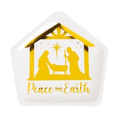 a paper plate with a nativity scene in the shape of a house and a baby jesus