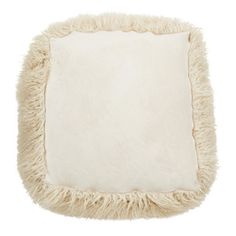 a white square pillow with shaggy edges on a white background, it looks like something out of space