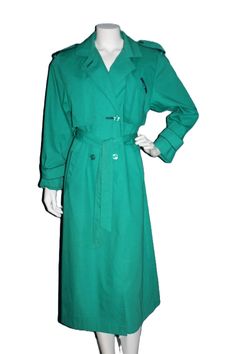 Vintage 1980's green trench coat Collection Elegante of Thunder Bay Water repellant material, 65% polyester and 35% cotton  Condition is very good.  Label Size: 7/8 Bust: 38" or 96.5 cm Waist: 36" or 91.5 cm Sleeve: 22" or 56 cm Between the back shoulder seams: 15.75" or 40 cm Length: 48" or 122 cm For a complete view of everything RalphsCloset has to offer visit             https://www.etsy.com/shop/ralphscloset/ Clothing is measured on the outside so please allow up to 2" for optimal fit. Vintage Green Double-breasted Outerwear, Green Trench Coat, Thunder Bay, Back Shoulder, Label Sizes, Trench Coat, Jackets For Women, Jackets & Coats, Size 7