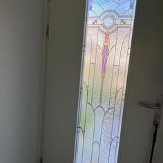 an open door with a stained glass window