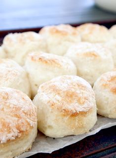 some biscuits are sitting on a baking sheet