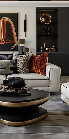 a living room filled with white couches and black tables in front of a painting