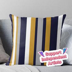 a striped pillow with the words support independent artists on it