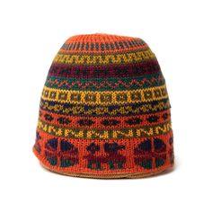 an orange and yellow knitted hat with elephants on the front, against a white background