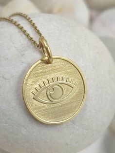 Dainty Evil Eye Necklace, solid gold 14k, Nazar Symbol Pendant, Evil Eye Pendant, Third Eye Necklace, Protection Symbol, necklace for gift.(ask us to do it for you in the size you want). 1.43cm 14k Gold Engraved Amulet Charm Necklace, Engraved 14k Gold Amulet Charm Necklace, Symbolic 14k Gold Necklace With Coin Pendant, 14k Gold Symbolic Coin Pendant Necklace, 14k Gold Coin Pendant Symbolic Necklace, 14k Gold Coin Pendant Necklace, Symbolic 14k Stamped Pendant Necklace, Yellow Gold Charm Necklace With Coin Pendant As Gift, 14k Gold Round Amulet Charm Necklace