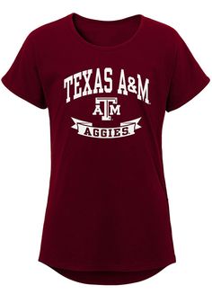 Kids, show your support for your favorite team in this Texas A&M Aggies Girls Maroon Short Sleeve Tee! This T-Shirt features a screen print team wordmark and logo on center chest, so everyone will know you cheer for the Texas A&M! This is the perfect Texas A&M Aggies Girls T-Shirt for wearing from every day to game day. Gig 'Em! Team graphic, Scoop neck, Double stitched hems, Longer curved back hemline, Relaxed fit, 100% Cotton, Machine Washable, DOMESTIC Sporty University Logo Tops For Sports, Sporty University Logo Sports Tops, Sporty Tops With University Logo For Sports, Sports Tops With University Logo For Sports Season, University Logo Sports Tops For Sports Season, Central Park Manhattan, Maroon Shorts, Curved Back, Texas A&m