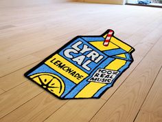 a floor mat with a carton of lemonade sitting on top of the floor