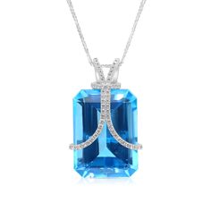 Make a statement with our Unique Cut Blue London Topaz Pendant Necklace. This necklace sits beautifully on your neck giving a striking look from its emerald cut blue topaz center stone wrapped by two embellished ribbons leading into a unique, hand crafted, adorned bail. The gemstone lays atop an 18K white gold elevated filigree style setting for extra detail. 
33.06 carat Emerald cut natural London Blue Topaz
0.50 carat pave diamond setting
18k white gold
The Pendant design can be Luxury White Topaz Jewelry With Gemstone Accents, London Topaz, Blue Topaz Pendant Necklace, Blue Topaz Pendant, Topaz Pendant, Stone Wrapping, Orange Sapphire, Diamond Settings, Tennis Bracelet Diamond