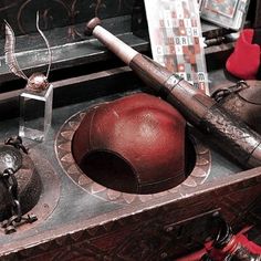 an old baseball bat, hat and other items on a table