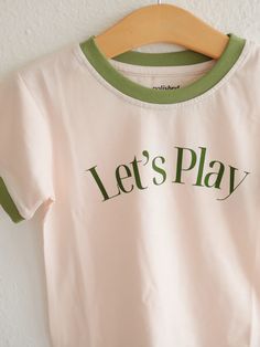 The Let's Play Ringer Tee for kids is a fun summer shirt to for kids and toddlers to wear during all the things life brings. We love the simple design that is gender neutral and really goes with everything. 100% organic cotton Runs true to size, pre-shrunk Printed labels on the neckline Desk Stickers, Kids Picnic, Play Shop, Play Book, Kids Graphic Tees, Ringer Tee, Lets Play, Fun Summer, Printing Labels